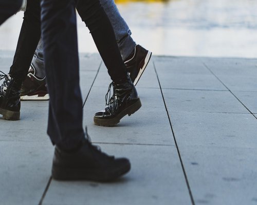 A pair of comfortable walking shoes on a city sidewalk